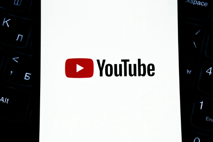 Youtube logo on a white background with keyboard.
